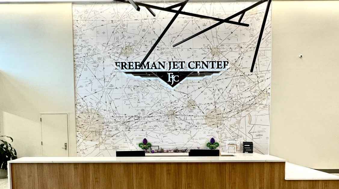 A sectional map of Acadiana Regional Airport is installed behind the customer service desk at the Freeman Jet Center, part of the new artwork in the renovated FBO.